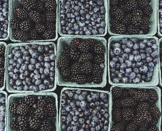 black berries on black surface