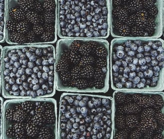 black berries on black surface