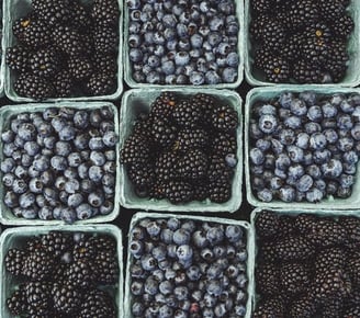 black berries on black surface