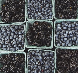 black berries on black surface