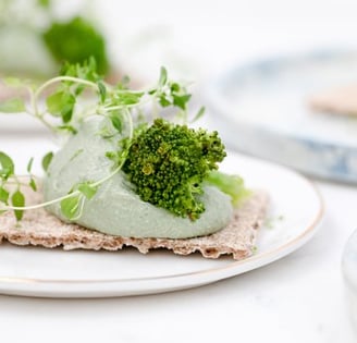 green vegetable on white ceramic plate
