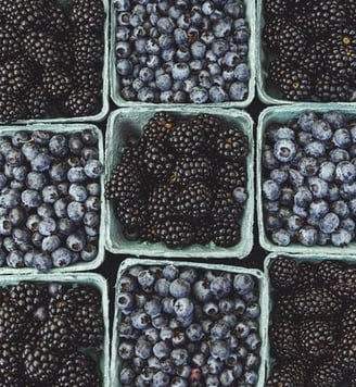 black berries on black surface
