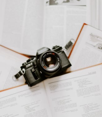 black nikon dslr camera on white printer paper