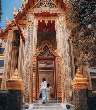 man and woman standing in front of brown concrete building during daytime