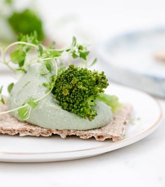 green vegetable on white ceramic plate