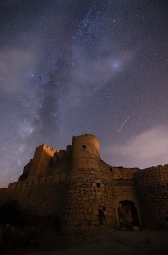 brown concrete building under starry night