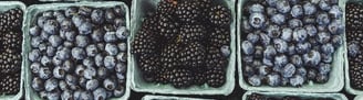 black berries on black surface