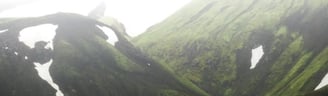 green mountain under white sky during daytime