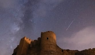 brown concrete building under starry night