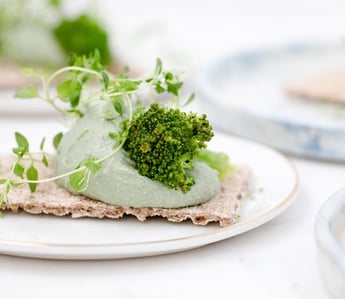 green vegetable on white ceramic plate