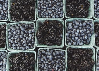 black berries on black surface