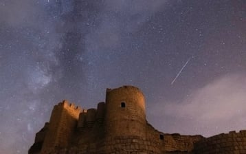 brown concrete building under starry night