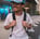 man in white crew neck t-shirt wearing blue cap and black sunglasses