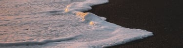 ocean waves crashing on shore during daytime