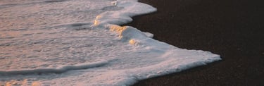ocean waves crashing on shore during daytime