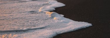 ocean waves crashing on shore during daytime