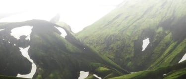 green mountain under white sky during daytime