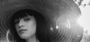 woman in white crew neck shirt wearing brown sun hat