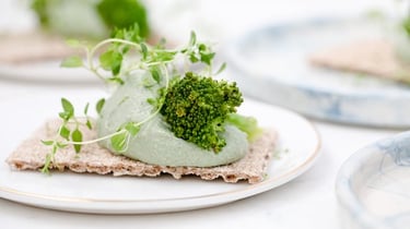 green vegetable on white ceramic plate