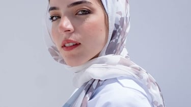woman in white hijab smiling