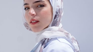 woman in white hijab smiling