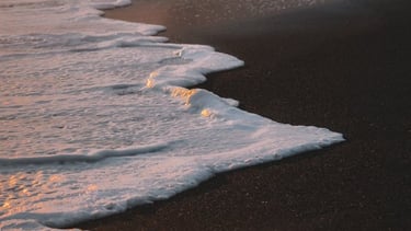 ocean waves crashing on shore during daytime
