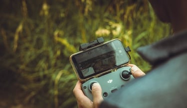person holding black and gray digital camera
