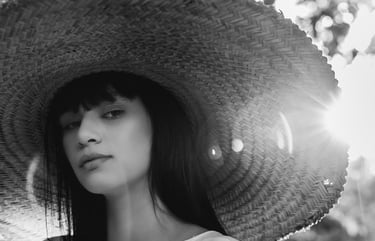 woman in white crew neck shirt wearing brown sun hat