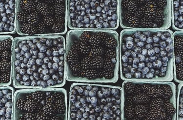 black berries on black surface