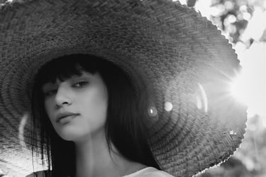woman in white crew neck shirt wearing brown sun hat