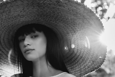 woman in white crew neck shirt wearing brown sun hat