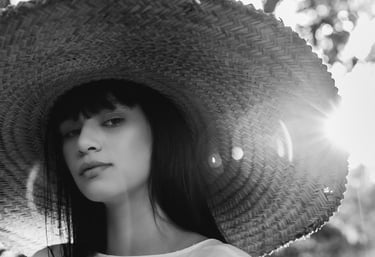 woman in white crew neck shirt wearing brown sun hat