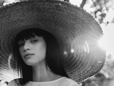 woman in white crew neck shirt wearing brown sun hat