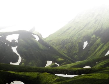 green mountain under white sky during daytime