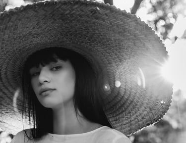 woman in white crew neck shirt wearing brown sun hat