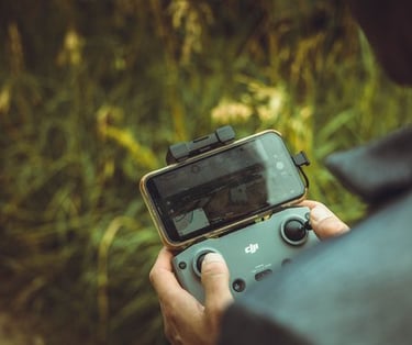 person holding black and gray digital camera