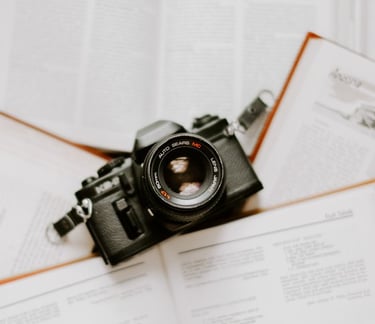 black nikon dslr camera on white printer paper
