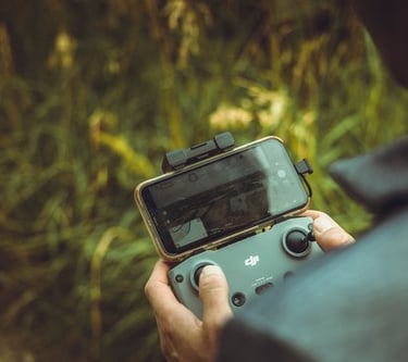 person holding black and gray digital camera