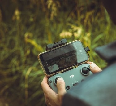 person holding black and gray digital camera