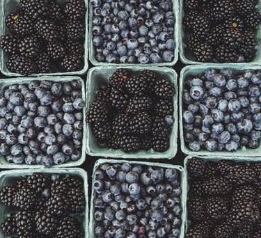 black berries on black surface