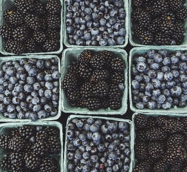 black berries on black surface