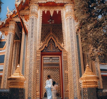 man and woman standing in front of brown concrete building during daytime