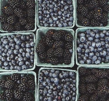 black berries on black surface
