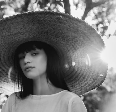 woman in white crew neck shirt wearing brown sun hat