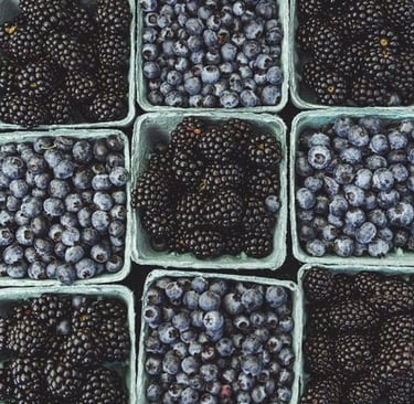 black berries on black surface