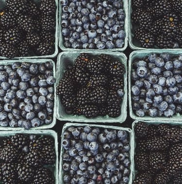 black berries on black surface