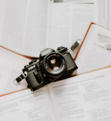 black nikon dslr camera on white printer paper