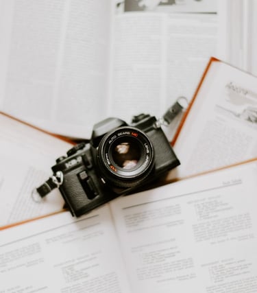 black nikon dslr camera on white printer paper