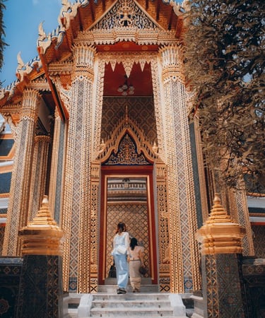 man and woman standing in front of brown concrete building during daytime