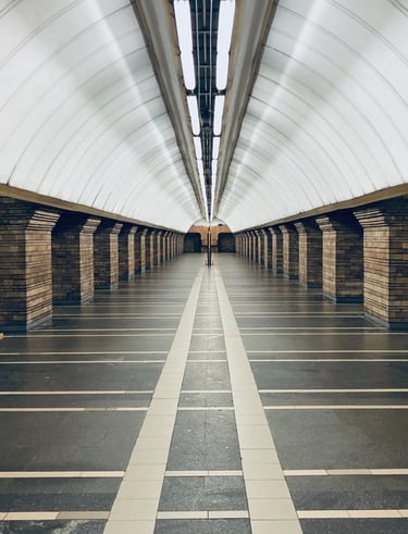 man in black jacket walking on hallway